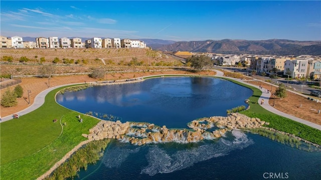 aerial view featuring a water and mountain view