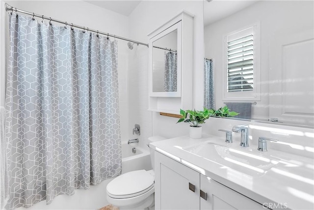 full bathroom with toilet, vanity, and shower / tub combo