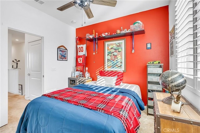 carpeted bedroom featuring ceiling fan