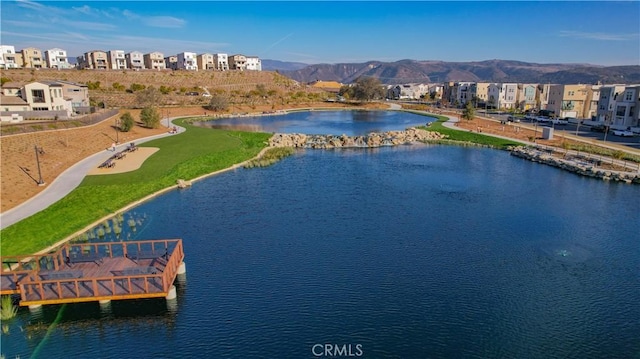 bird's eye view with a water and mountain view