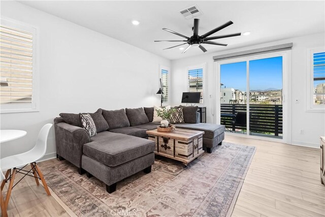 92 Juniper Dr, Rancho Mission Viejo, CA 92694 - living room with recessed lighting, light wood finished floors, visible vents, and a ceiling fan