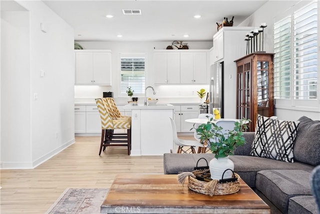 92 Juniper Dr, Rancho Mission Viejo, CA 92694 - living room featuring light wood-style floors, recessed lighting, visible vents, and baseboards