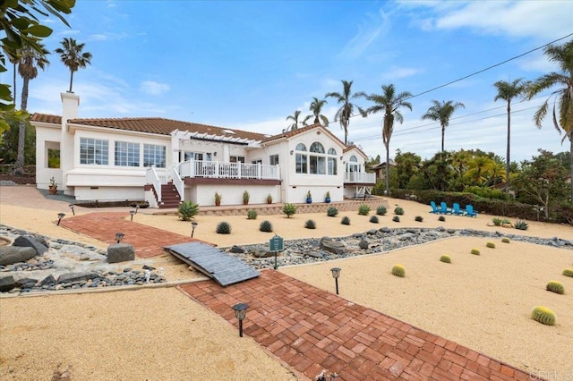 rear view of house featuring a patio area and a pergola