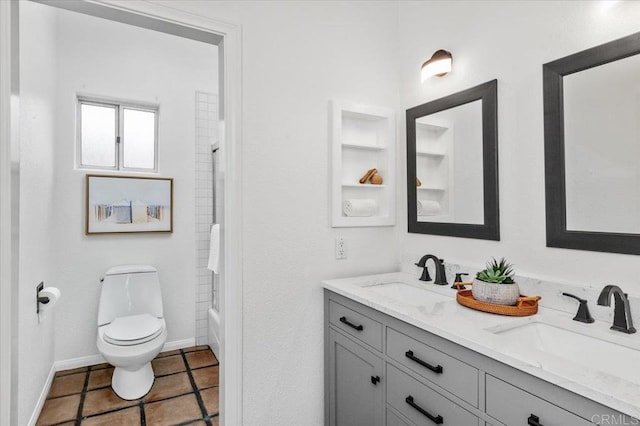 full bathroom with tiled shower / bath combo, vanity, tile patterned floors, and toilet