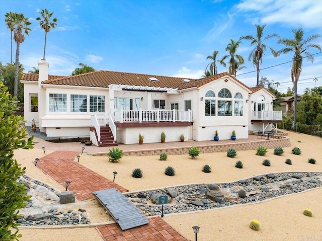 rear view of property featuring a patio area