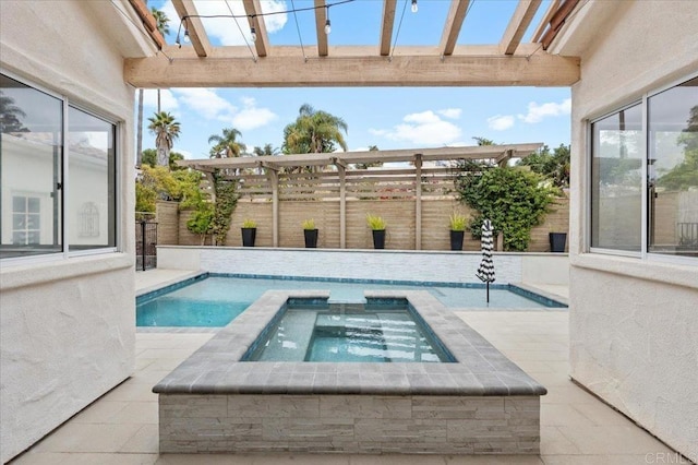 view of pool with an in ground hot tub