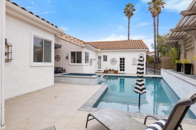 view of pool with an in ground hot tub and a patio