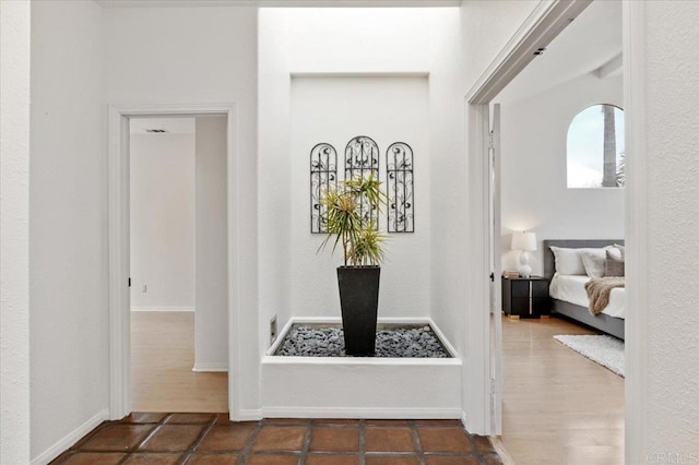 corridor with dark hardwood / wood-style floors