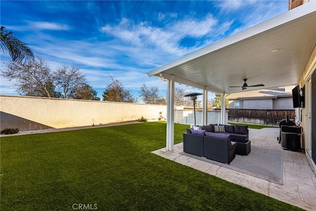 view of yard with ceiling fan, outdoor lounge area, and a patio area