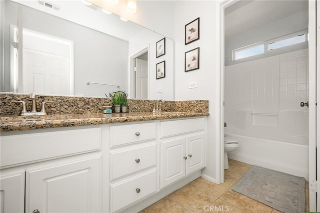 bathroom with double vanity, tile patterned flooring, a sink, and visible vents