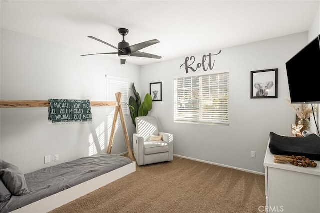 bedroom featuring carpet flooring, a ceiling fan, and baseboards