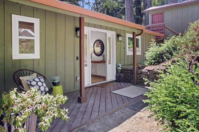 entrance to property with a deck