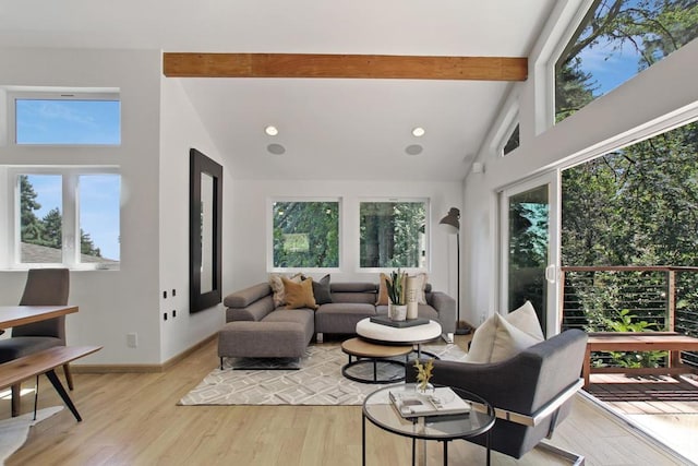 living room with beamed ceiling, plenty of natural light, high vaulted ceiling, and light hardwood / wood-style flooring