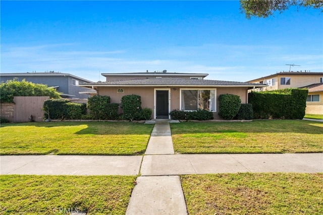 single story home with a front lawn