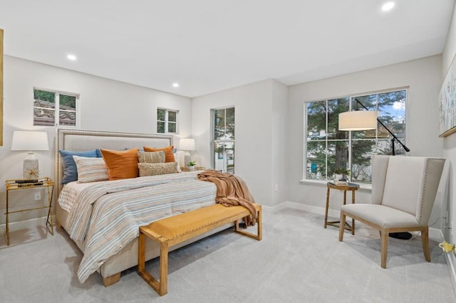 bedroom featuring light colored carpet