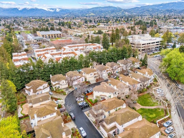 birds eye view of property featuring a mountain view