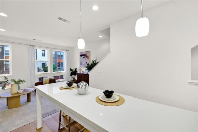 dining space featuring a wealth of natural light and light hardwood / wood-style floors