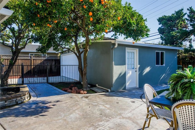 exterior space with an outbuilding and a patio