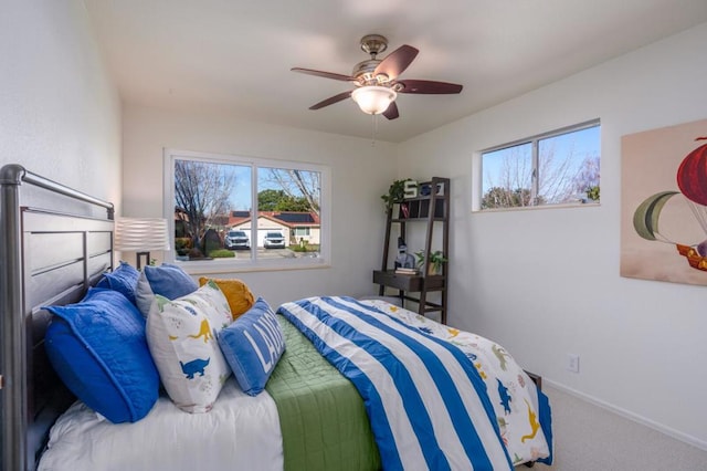 carpeted bedroom featuring ceiling fan