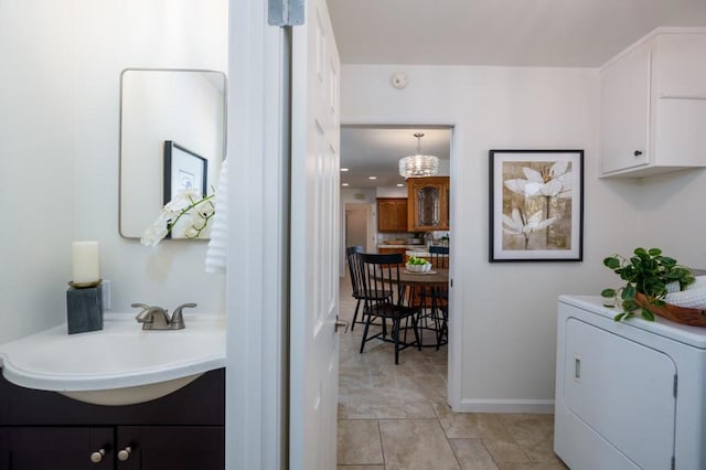 interior space with sink and washer / dryer