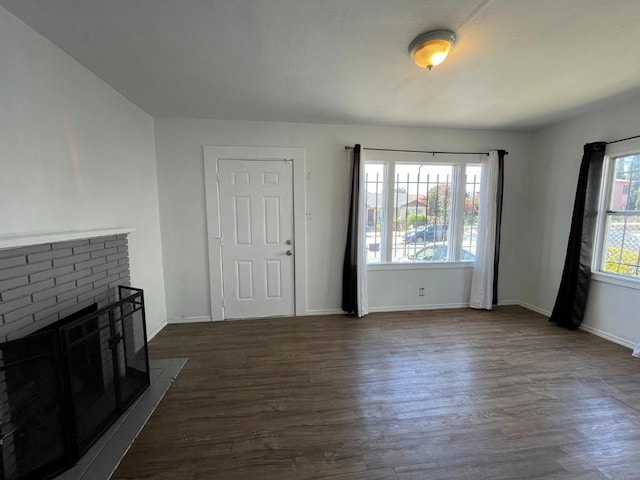 living room featuring dark hardwood / wood-style floors and a fireplace