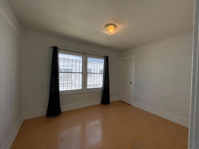 unfurnished room featuring light hardwood / wood-style floors