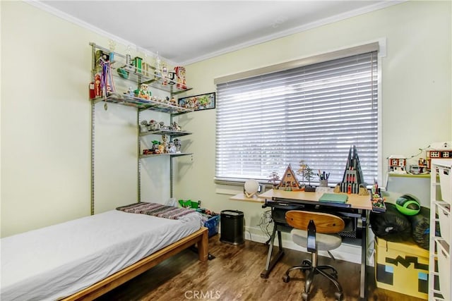 bedroom featuring hardwood / wood-style flooring and crown molding