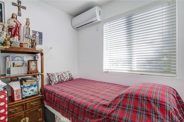 bedroom with a wall mounted air conditioner