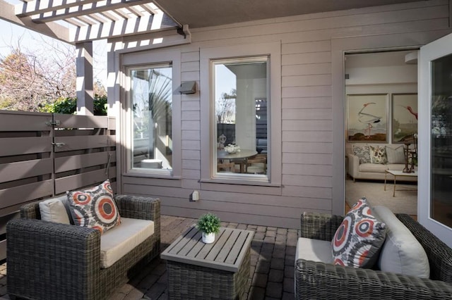 view of patio / terrace with an outdoor living space and a pergola