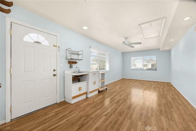 entryway featuring ceiling fan and light wood-type flooring