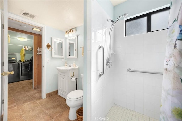 bathroom featuring walk in shower, vanity, and toilet