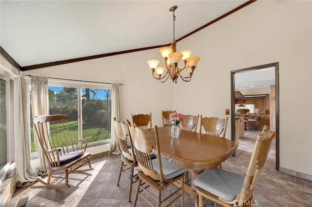 dining area with crown molding, a chandelier, and vaulted ceiling