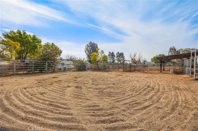 view of yard with a rural view