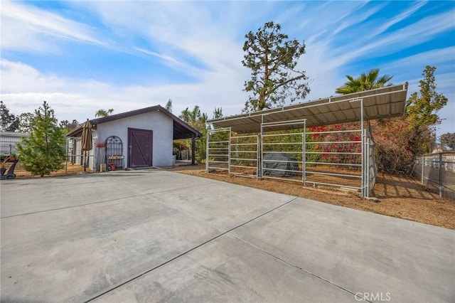 view of property exterior featuring an outdoor structure