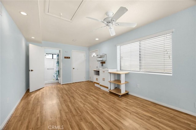 foyer entrance featuring ceiling fan and light hardwood / wood-style floors