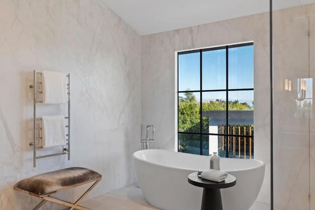 bathroom featuring a tub to relax in