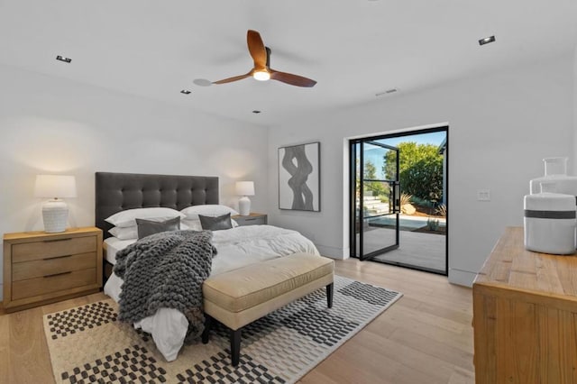 bedroom featuring ceiling fan, light hardwood / wood-style flooring, and access to outside