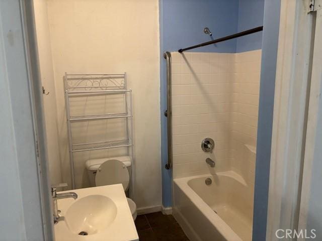 full bathroom with tile patterned flooring, sink, shower / bathtub combination, and toilet