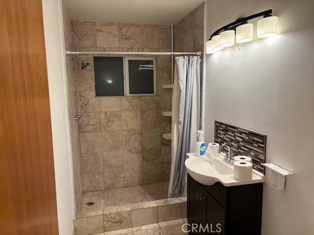 bathroom featuring vanity and walk in shower