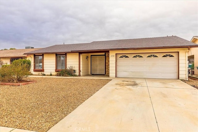 ranch-style home featuring a garage