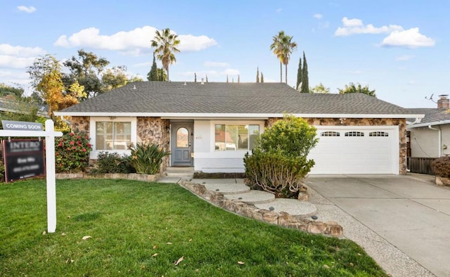 ranch-style house featuring a garage and a front yard