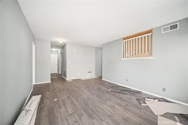 spare room with wood-type flooring