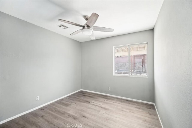 spare room featuring ceiling fan and light wood-type flooring