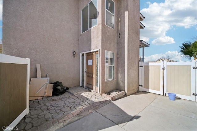 back of property featuring a patio area