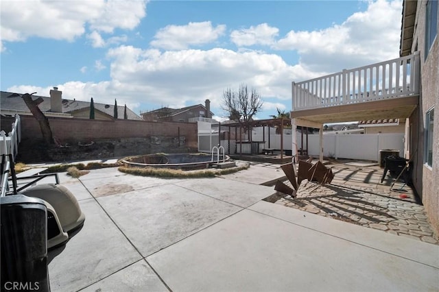 view of patio / terrace featuring a swimming pool