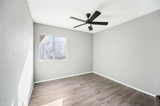 unfurnished room featuring ceiling fan and light hardwood / wood-style floors