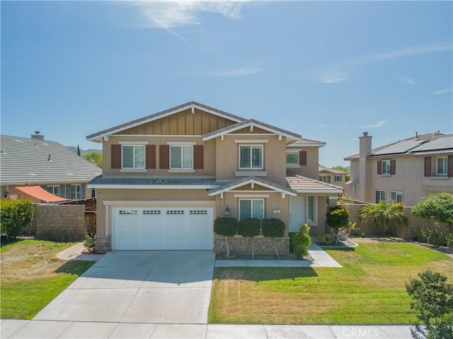 view of front of house featuring a garage and a front yard