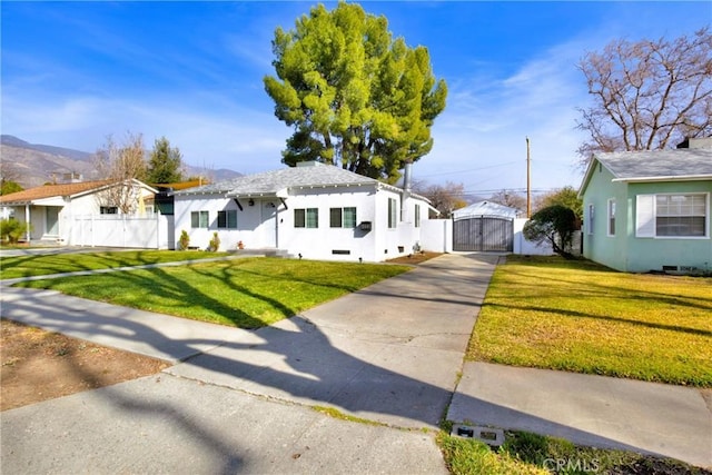 bungalow featuring a mountain view and a front yard