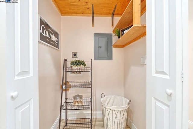 interior space featuring electric panel and wood ceiling