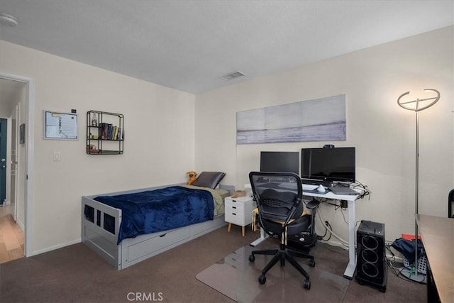 bedroom with visible vents and baseboards